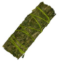 Bundled sage with green twine on a white background