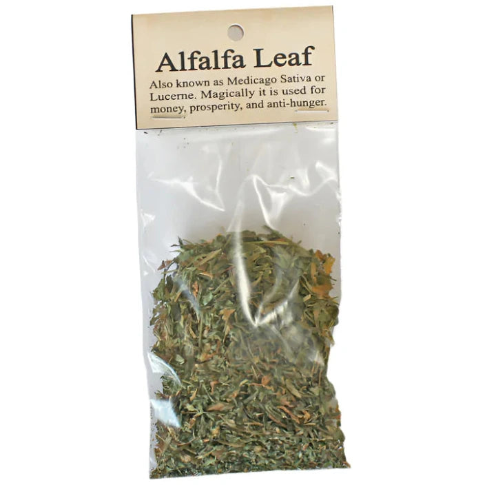 Bag of alfalfa leaves with a label on a white background